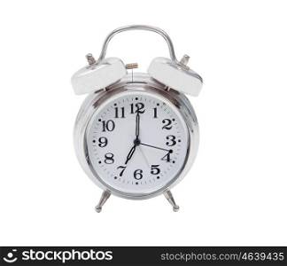 Silvered alarm clock isolated on a white background