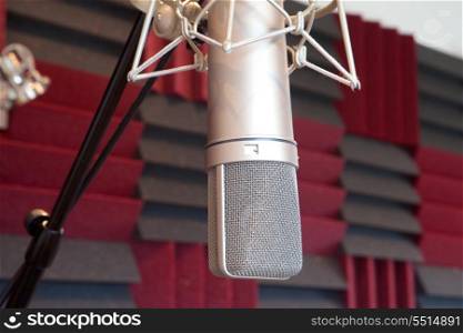Silvered professional microphone in recording studio