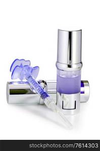 silvery ampoules, small bottles, medical or cosmetic appointment and syringe