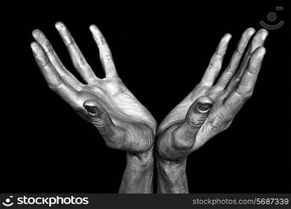 Silvery male hands isolated on black background