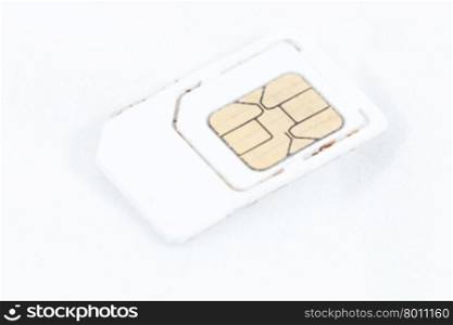 SIM card for the phone is placed on a white background.