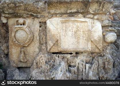 Simbol of roman legion on the wall of aqueduct near Caesarea in Israel