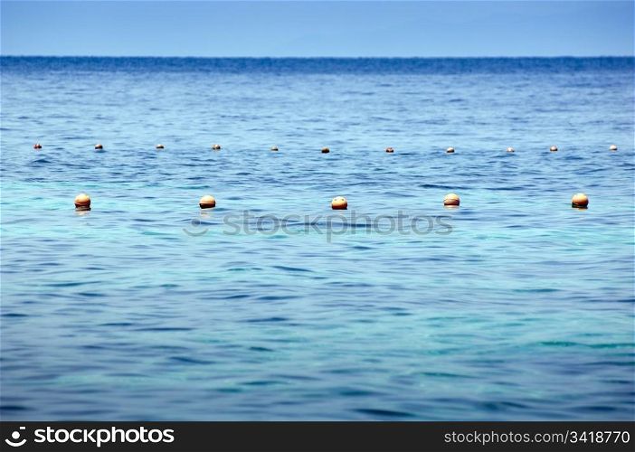 Simple composition of ocean buoys in rich blue water
