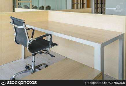 Simple office room with table and chair