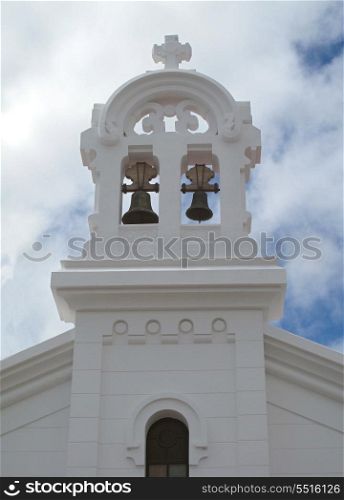 Simple white bell tower of a church