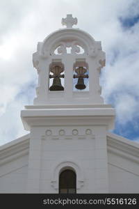 Simple white bell tower of a church