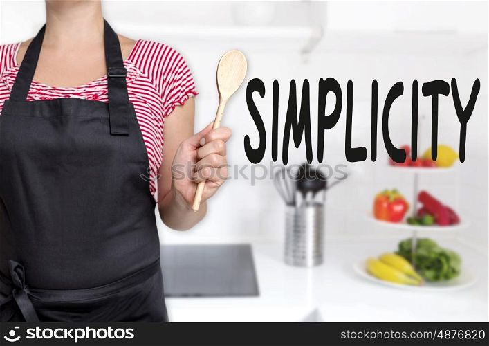 simplicity cook holding wooden spoon concept background. simplicity cook holding wooden spoon concept background.