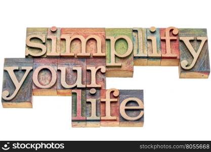 simplify your life advice - isolated word abstract in letterpress wood type