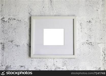 Simply picture frame on white wall, stock photo