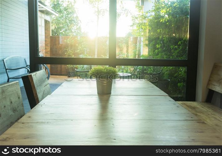 Simply plant bucket decorated on wooden table, stock photo
