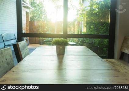 Simply plant bucket decorated on wooden table, stock photo