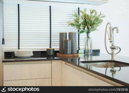 Simply style kitchen counter with black granite counter top
