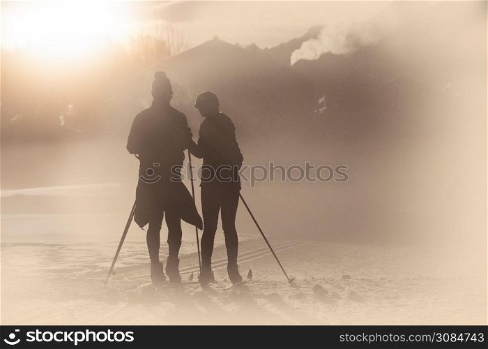 Simulations of old photography with artifacts. Cross-country skiing couple.
