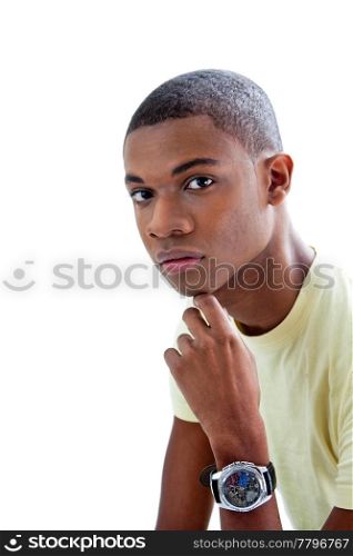Sincere young African man in yellow shirt and hand under chin, isolated
