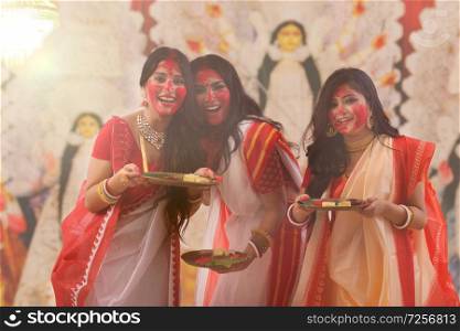 Sindoor Kheyla by Married Ladies during Durga Puja