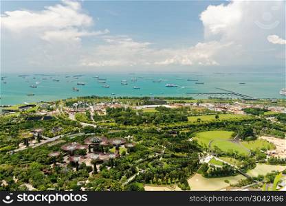 Singapore-April 2018.View from the top floor Marina Sands Hotel at Gardens by the bay and ocean in Singapore, April 2018.Editorial.Horizontal view.. Singapore-April 2018.View from the top floor Marina Sands Hotel