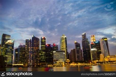 Singapore ,April 3 -2016 Business buildings shining of light at night time around Marina Bay and river Singapore Singapore April, 3 , 2016