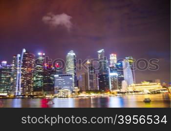 Singapore ,April 3 -2016 Business buildings shining of light at night time around Marina Bay and river Singapore Singapore April, 3 , 2016