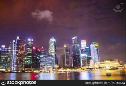 Singapore ,April 3 -2016 Business buildings shining of light at night time around Marina Bay and river Singapore Singapore April, 3 , 2016