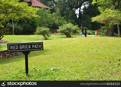 Singapore Botanic Garden With red brick path sign