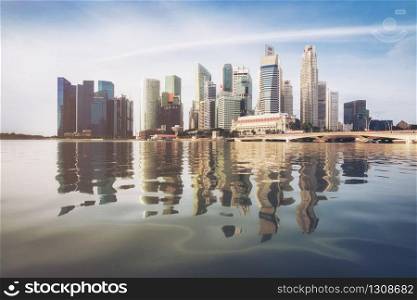 Singapore central business district skyline, blue sky and morning sunrise at marina bay. Singapore city skyline. Singapore cityscape.