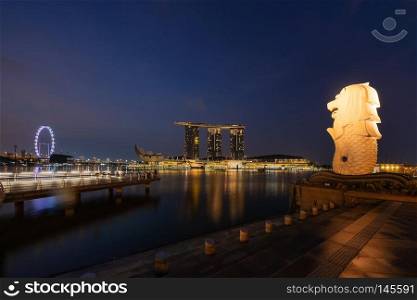 Singapore City - July 29, 2018 : Merlion and Marina Bay Sands at night with Singapore Flyer.