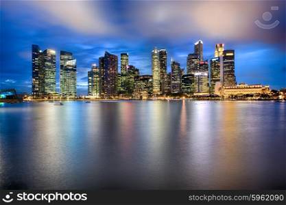 Singapore city skyline at night with reflection