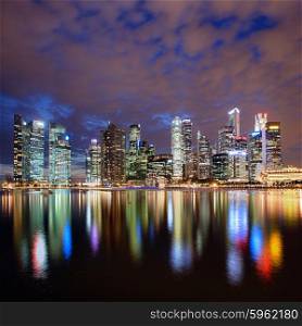 Singapore city skyline at night with reflection