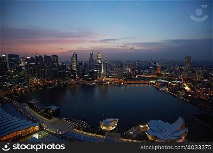 Singapore cityscape and harbor at night