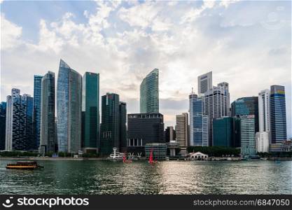 Singapore Cityscape Financial building with Dramatic Cloud in Ma. Singapore - March 25, 2017: Singapore Cityscape Financial building with Dramatic Cloud in Marina Bay area Singapore, Urban Dusk