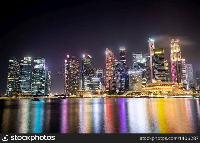 Singapore downtown cityscape of business district downtown skyline and city skyscraper dusk at Marina Bay in night time.