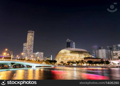 Singapore downtown cityscape of business district downtown skyline and city skyscraper dusk at Marina Bay in night time.