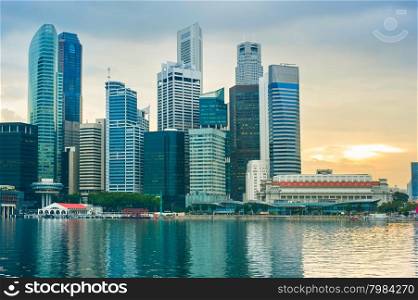 Singapore Downtown Core reflected in the river at sunset