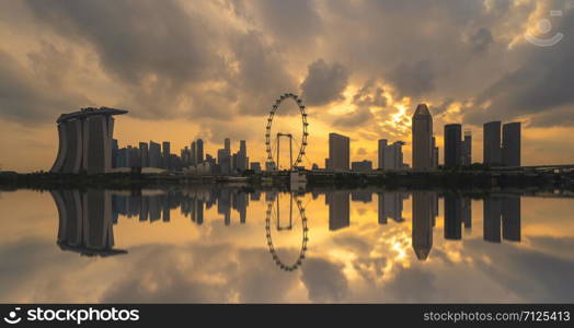 Singapore Downtown skyline at sunset with reflection. Financial district and business centers in technology smart urban city in Asia. Skyscraper and high-rise buildings.