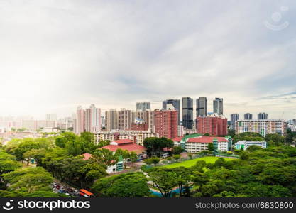 Singapore downtown with skyscrapers and traditional Apartments, Singapore House sunset with Sun flare