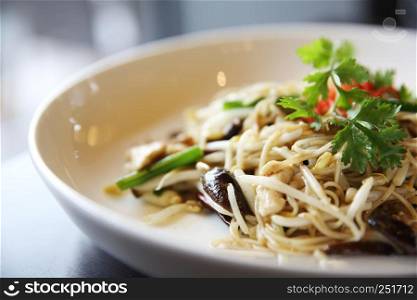 Singapore fried noodle on wood background