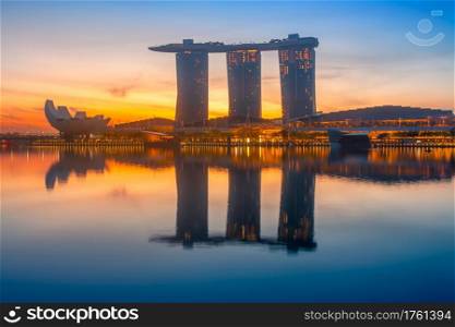 Singapore. Marina Bay Sands Hotel. Colorful sunrise and calm water of the bay. Marina Bay Sands at Dawn