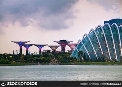 Singapore overview with Gardens by the Bay at the sunset time