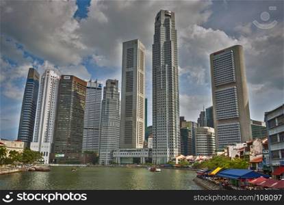 SINGAPORE,SINGAPORE 11-03-2017: The skyline of singapore with the terraces and restaurants in the centre of the city, Singapore is the biggest harbour in Asia. Singapore harbour with the river and terraces