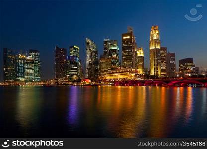 Singapore skyline and Marina Bay in evening