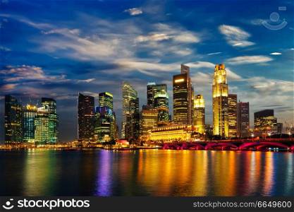Singapore skyline and Marina Bay in evening. Singapore skyline in evening