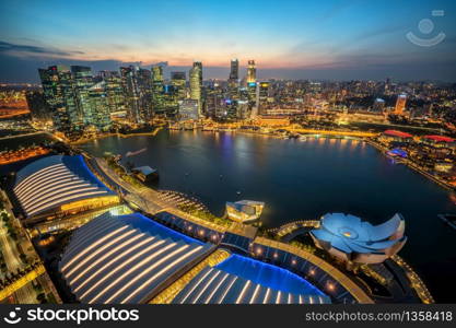 Singapore Skyline at Marina Bay from Aerial View during Sunset. Singapore Central Area and Cityscape at Night in Marina Bay. Singapore City and Skyline at Financial District, Downtown at Marina Bay.
