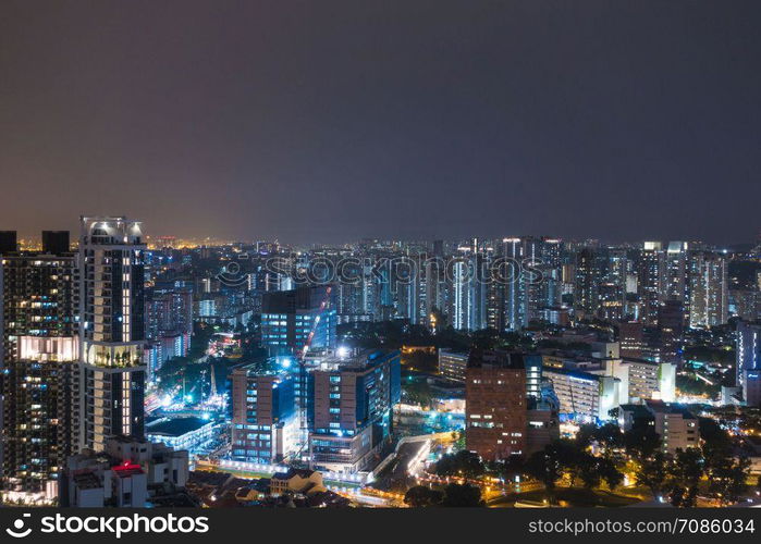 Singapore tall buildings at night.Business district and high-rise building in Singapore