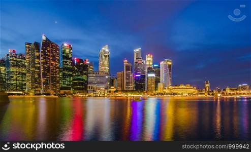 Singapore the city of colors lights and beautiful water at nighttime it is Singapore tourrism businesses town reflections river to night time and over colourful concept