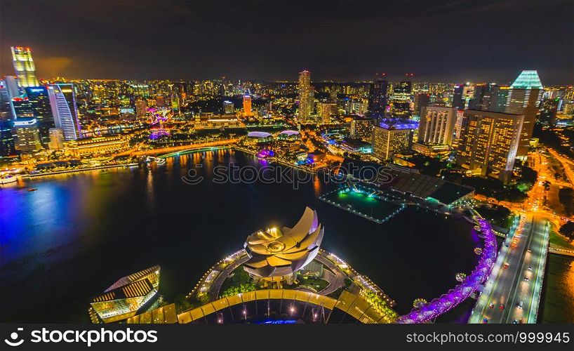 Singapore the city of colors lights and beautiful water at nighttime it is Singapore tourrism businesses over colourful and perspective aerial view to sport focus blurred
