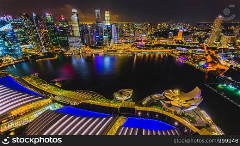 Singapore the city of colors lights and beautiful water at nighttime it is Singapore tourrism businesses over colourful and perspective aerial view selective right corner focus blur background