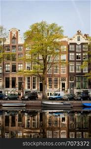 Singel canal historic terraced houses in the city of Amsterdam, Netherlands.