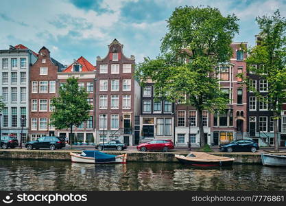 Singel canal in Amsterdam with old houses. Amsterdam, Netherlands. Singel canal in Amsterdam with houses. Amsterdam, Netherlands