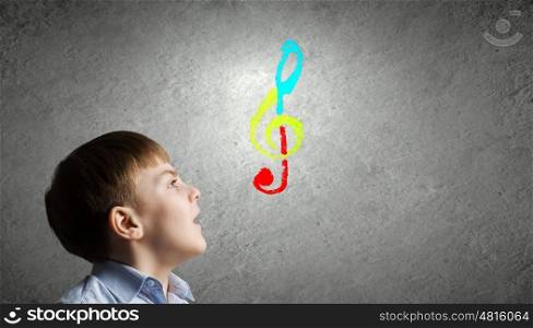 Singing boy. Colorful music symbol and cute boy singing