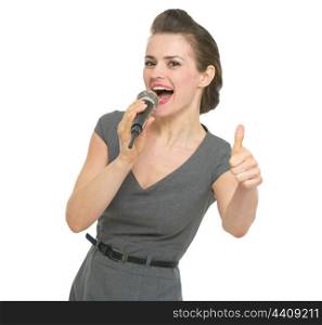 Singing in microphone woman showing thumbs up